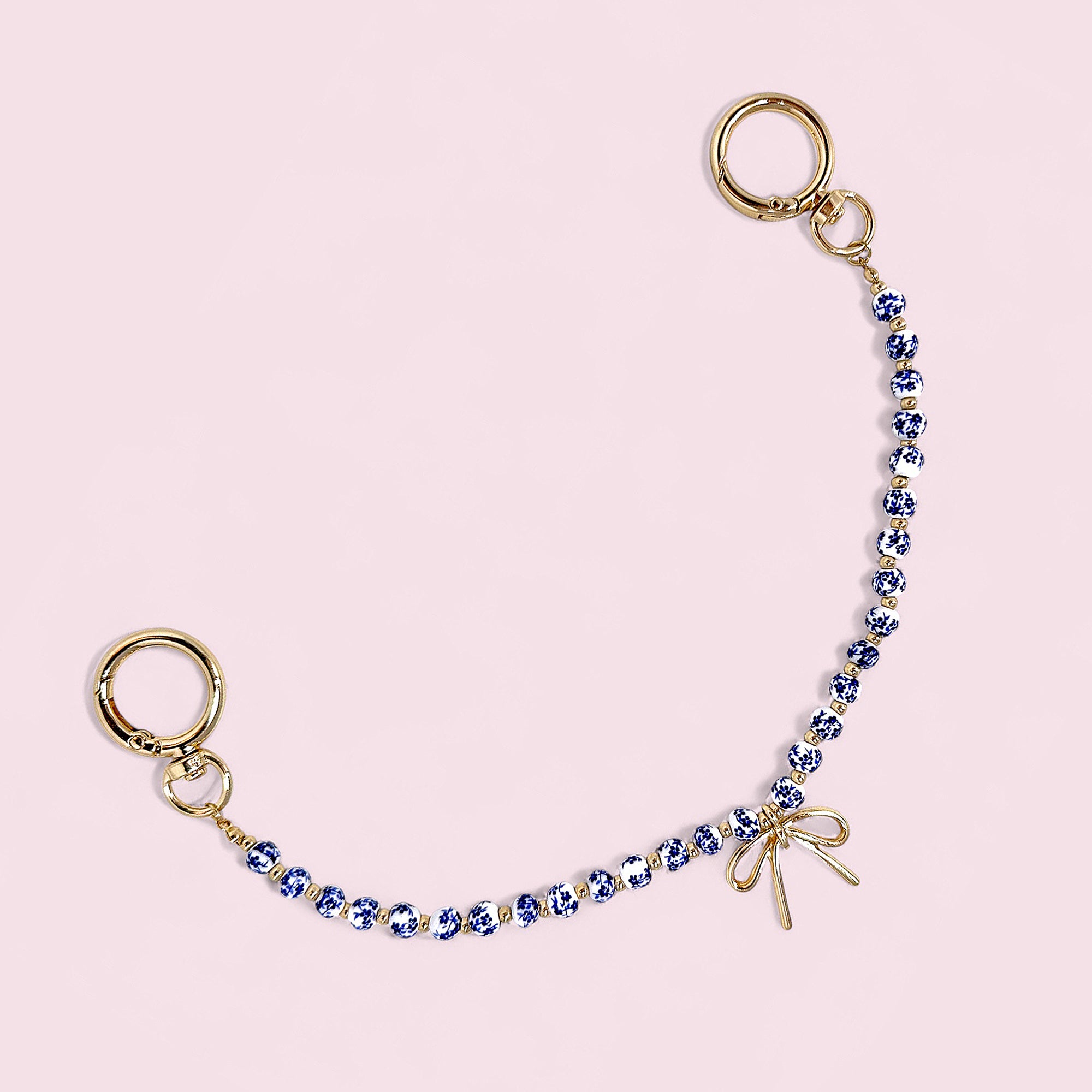 Blue & White Porcelain Bead Bag Charm – Gold Bow Accent